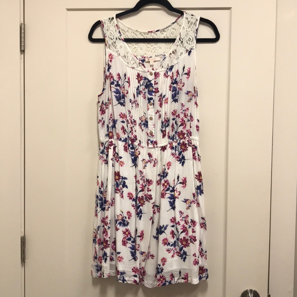 White floral dress with lace trim.